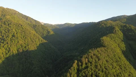 Aerial Drone View of Mountain Ridge Above Village and Fields, Georgia 4K 스톡 동영상 337354460