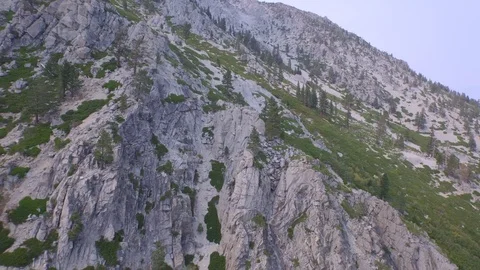Aerial drone view of mountain rocks and cliff, Tahoe Lake, California Video stock 100848652
