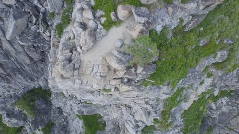 Aerial drone view of mountain rocks and cliff, Tahoe Lake, California Stock Footage 100848983