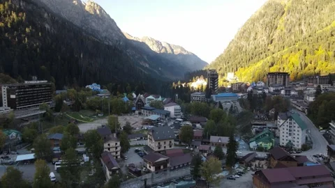 Aerial drone view of a mountain valley town and river Stock Footage 337529093