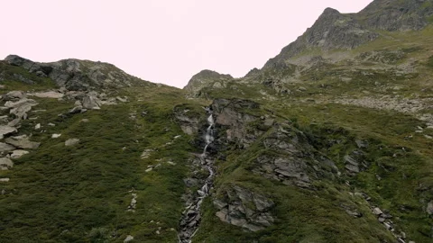 Aerial drone view of a mountain waterfall on the Italian Alps Stock Footage 251990399