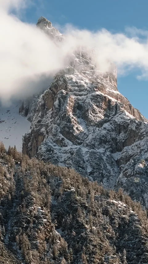 Aerial drone view of the mountains in the clouds, in the Dolomites, Italy. Stock Footage 301831724