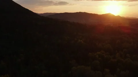 Aerial drone view of mountains forest landscape under sunset amazing epic sky Stock Footage 280378380