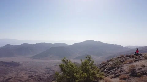 Aerial drone view of mountainside overlooking Coachella Valley Stock Footage