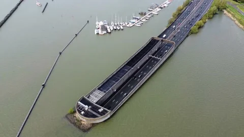 Aerial drone view moving over road tunnel going underwater 4k Stock Footage 170597880
