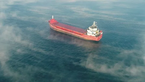 Aerial drone view moving through the fog on container cargo freight oil tanker Stock Footage 336446247