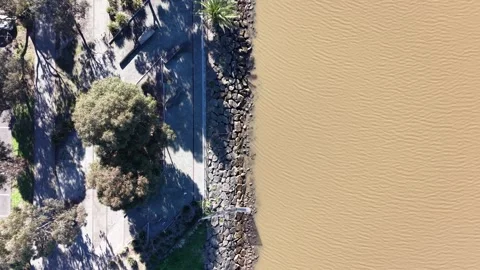 Aerial drone view of muddy river water flowing 스톡 동영상 340513431