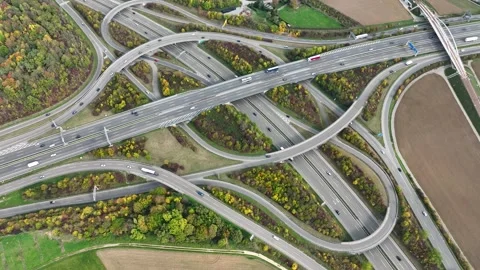 Aerial drone view of a multi-level highway intersection with moving cars Stock Footage 241442010