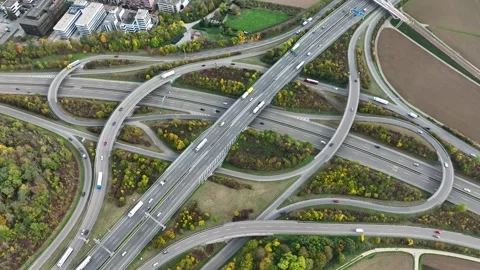 Aerial drone view of a multi-level highway intersection with moving cars Stock Footage 242328391