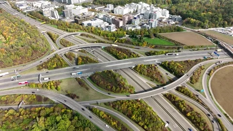 Aerial drone view of a multi-level highway intersection with moving cars Stock Footage 243156744