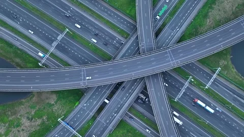 Aerial drone view of a multi-level highway intersection with moving cars Stock Footage 276619695