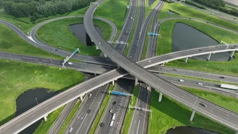 Aerial drone view of a multi-level highway intersection with moving cars Stock Footage 279814746