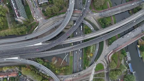Aerial drone view of a multi-level highway intersection with moving cars Stock Footage 291534237