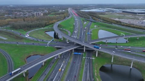 Aerial drone view of a multi-level highway intersection with moving cars 動画素材 344535722