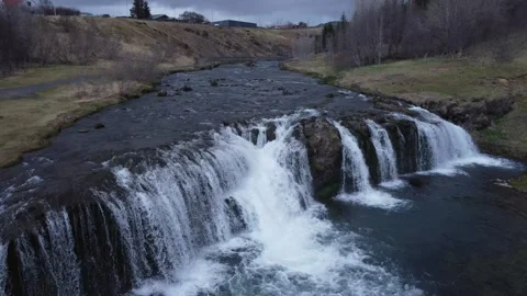 Aerial Drone View of Multi Stream Waterfall Flowing Through Rocky River Valley Stock Footage 342581828