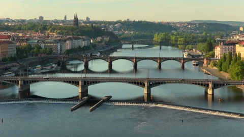Aerial drone view of multiple arched bridges spanning the Vltava river with a Stock Footage 336611098