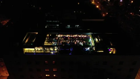 Aerial from drone view night rooftop party Stock Footage 111149023