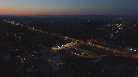 Aerial Drone view of nightlife in Sofia, Bulgaria. Traffic lights during the 스톡 동영상 115703273