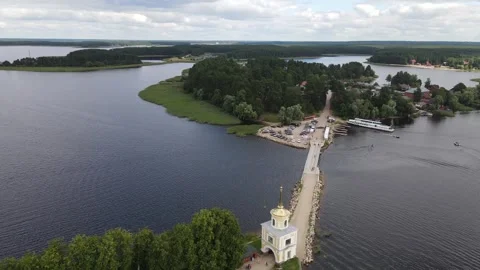 Aerial drone view of Nilov Monastery and bridge on Lake Seliger Video stock 338103392