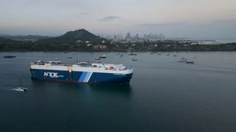 Aerial Drone View Of NYK Cargo Ship Near Panama City Downtown Skyline 2026/3/4 Stock Footage 337378252