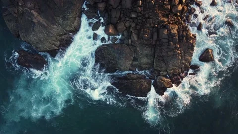Aerial drone view of ocean blue waves break on high cliff Stock Footage 176842279
