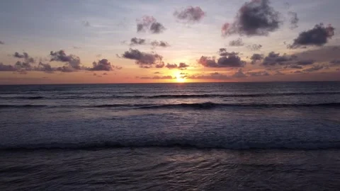 Aerial Drone View of Ocean Sunset with Waves in Bali Stockbeeldmateriaal 332638121