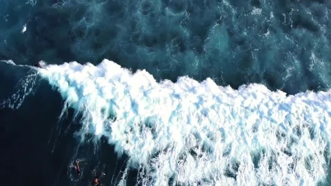 Aerial Drone View of Ocean Wave with Surfers Waiting in the Lineup Stock Footage 324657426