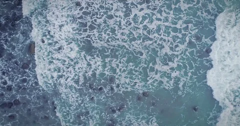 Aerial drone view of ocean waves breaking at sunset, New Plymouth New Zealand Video stock 83839146