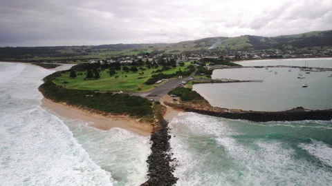 Aerial drone view of ocean waves crashing on an overcast stormy day Vidéo 248888820