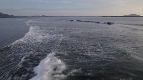 Aerial drone view of ocean waves at sunset Stock Footage 319995032