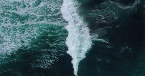 Aerial Drone View of Ocean Waves Crashing on Tropical Rocky Coastline Stock Footage 329657907