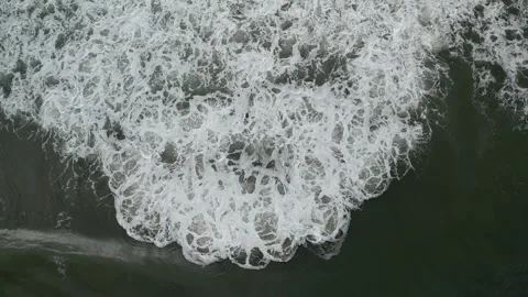 Aerial Drone View of Ocean Waves Breaking on Sandy Beach Shoreline Stock Footage 330271067