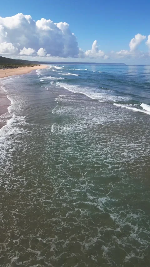 Aerial Drone View of Ocean Waves and Sandy Beach at Costa da Caparica, Lisbon Видео 335456466