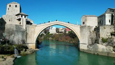 Aerial drone view of the Old Bridge in Mostar city in Bosnia &amp; Herzegovina Stock Footage 231795225