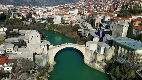 Aerial drone view of the Old Bridge in Mostar city in Bosnia &amp; Herzegovina Stock Footage 231795244