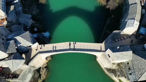 Aerial drone view of the Old Bridge in Mostar city in Bosnia &amp; Herzegovina Stock Footage 231795311