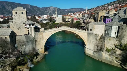 Aerial drone view of the Old Bridge in Mostar city in Bosnia and Herzegovina Stock Footage 232625925