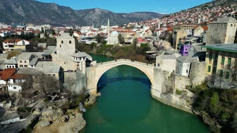 Aerial drone view of the Old Bridge in Mostar city in Bosnia and Herzegovina Stock Footage 232714631