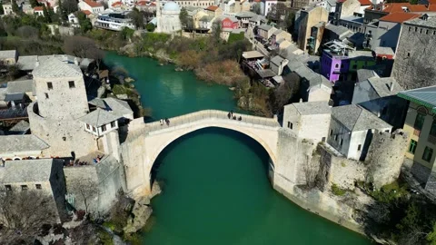 Aerial drone view of the Old Bridge in Mostar city in Bosnia and Herzegovina Stock Footage 232802798