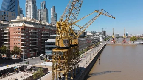 Aerial drone view of old cargo crane in Puerto Madero harbor, Buenos Aires Stock Footage 100886097