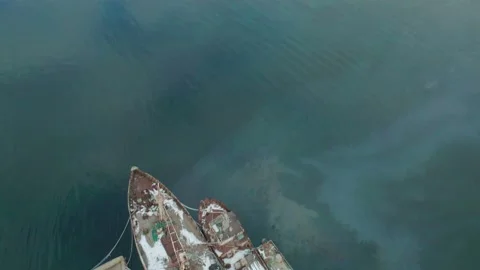 Aerial drone view of an old rusty ships moored in the harbor. Abandoned ships Vídeos de archivo 146529419