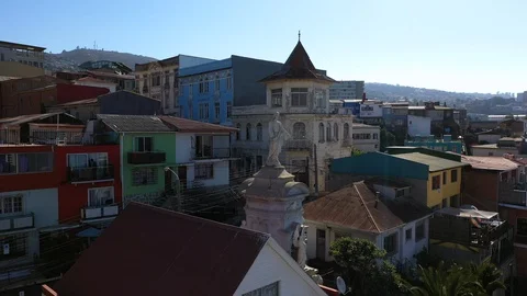 Aerial drone view of an old statue monument and authentic colorful houses and Stock Footage 105871564