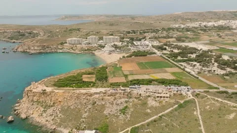 Aerial drone view of old tower, fields, beach sea. Malta Stock Footage 246420128
