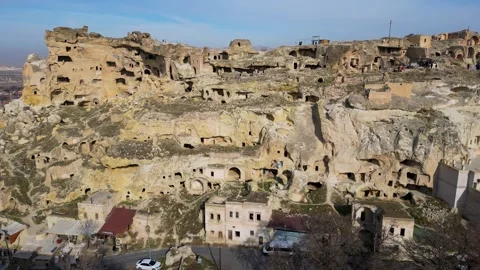 Aerial drone view the old troglodyte settlement of Cavusin, in Cappadocia Stock Footage 261171069