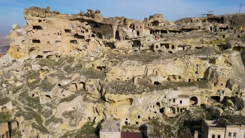 Aerial drone view the old troglodyte settlement of Cavusin, in Cappadocia Stock Footage 261554853
