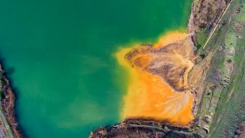 Aerial drone view of open pit dredging lake in a abandoned gravel mine Stock Photos