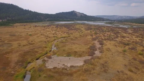 Aerial drone view, open prairie land and forest in rocky mountain of California Stock Footage 100861802