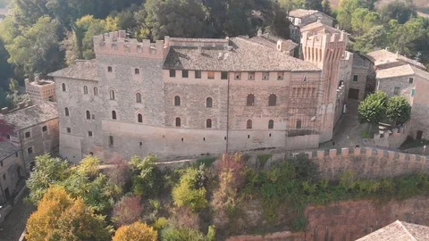 Aerial drone view over an ancient village with city walls and a tower. Stock Footage 113200630