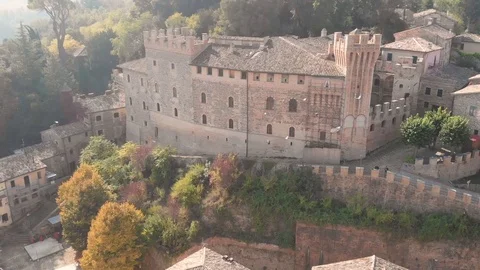 Aerial drone view over an ancient village with city walls and a tower. Stock Footage 113200632