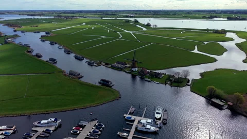 Aerial drone view over a busy marina with moored boats, opening up Stock Footage 336461542
